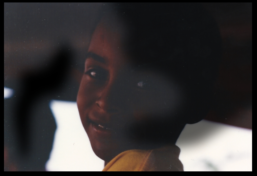 heavily shaded face of Fabi&eacute;n,
              close-up, as he looks over his left shoulder