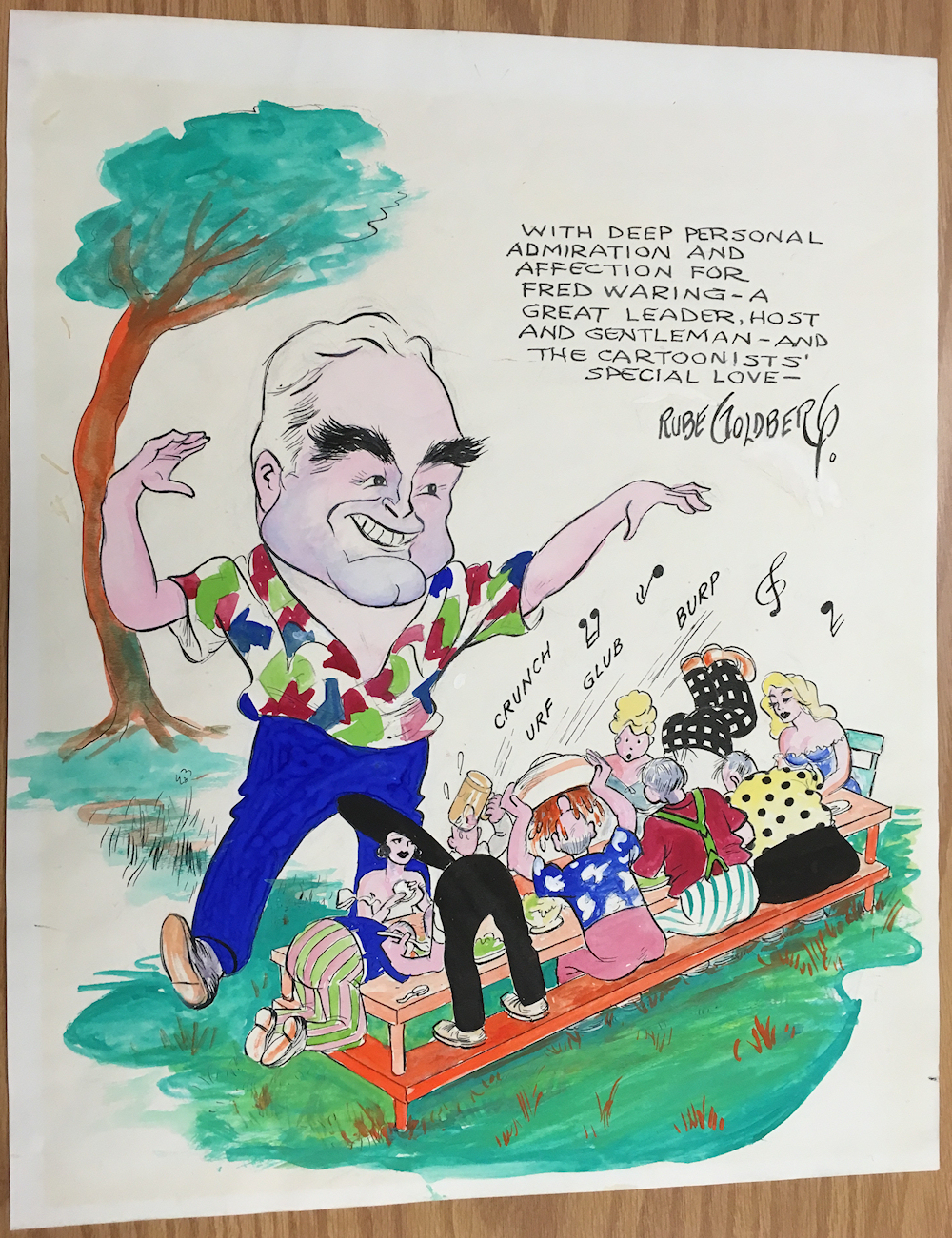 rowdy drinking gourmands picnic as
                directed by Fred Waring, color cartoon by Rube Goldberg
