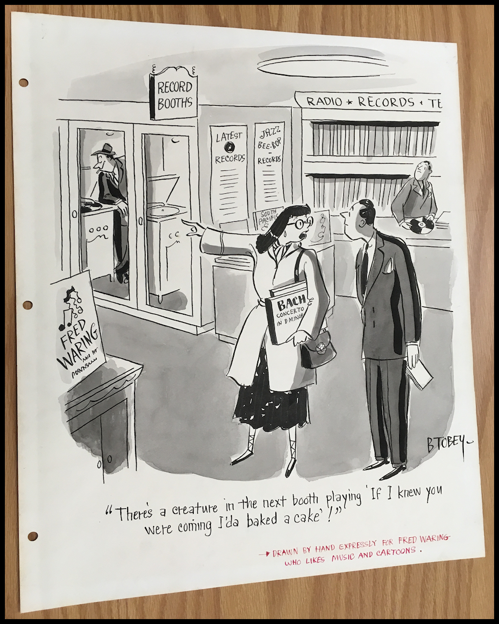 black and white drawing: woman
            holding Bach album complains about the Waring pop music
            emanating from one of the cubicles