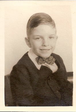 innocent-looking little boy mj in a Little Lord
                Fauntleroy suit with bowtie