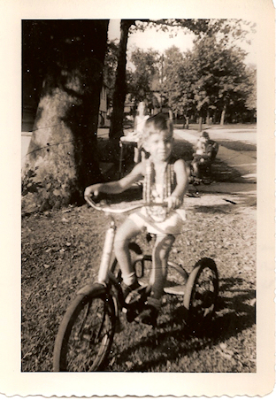 5 and a half year old mj on
                  tricycle, old family black and white