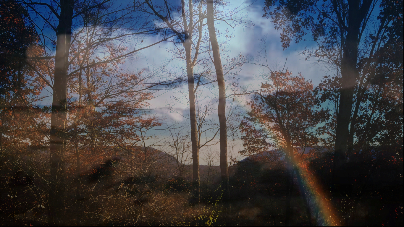 dark clouds over
              Delaware Water Gap offset by a rainbow